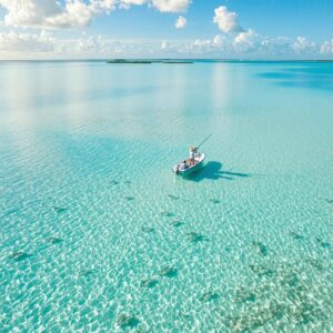 Aerial view of angler fly fishing in Ascension Bay's turquoise flats, Mexico - one of the best fly fishing vacations destinations with pristine waters and abundant bonefish